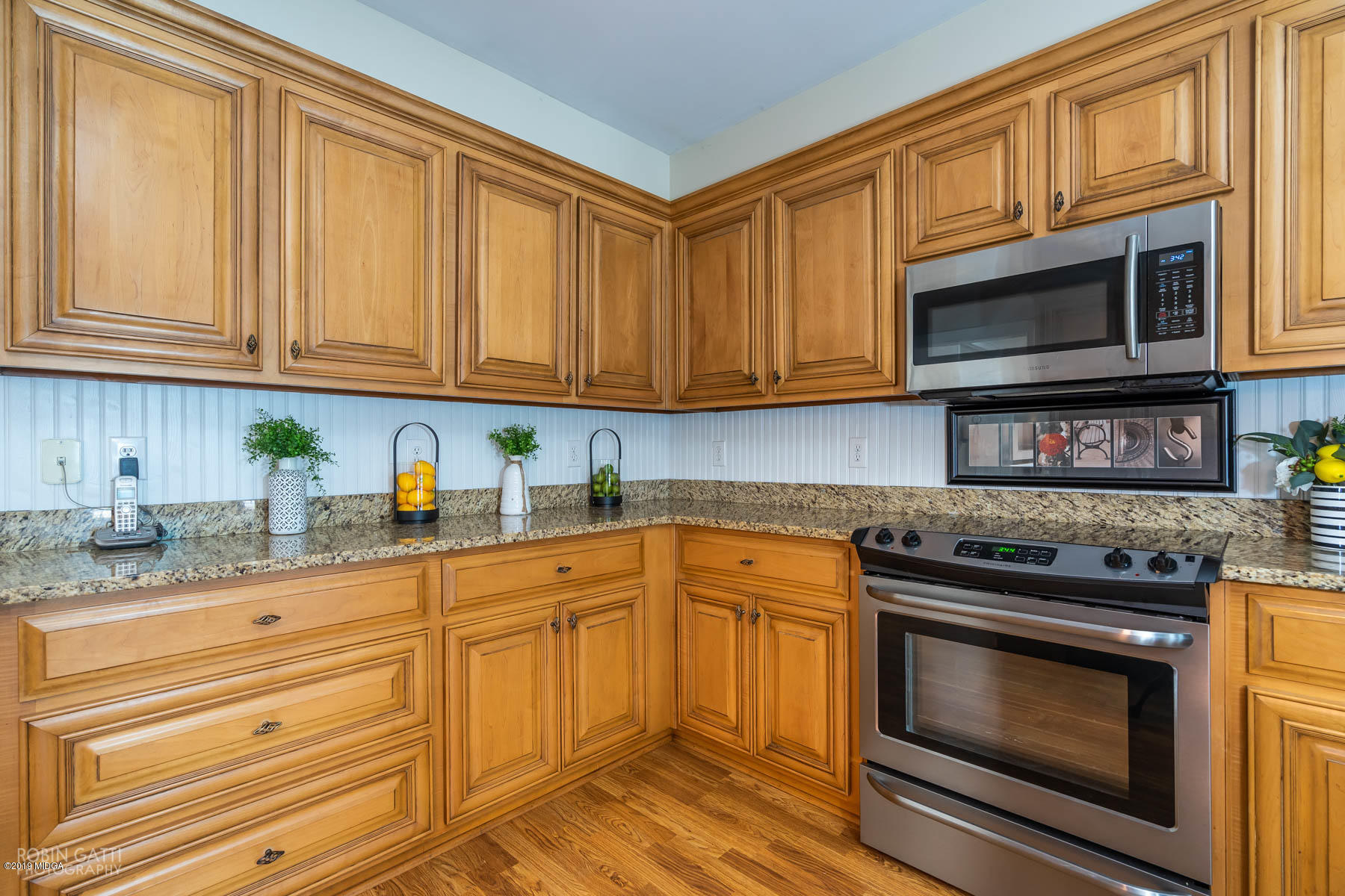 9801 Lower Thomaston Road Macon, GA 31220 - Photo 20 of 40 a kitchen with granite countertop cabinets stainless steel appliances and a sink