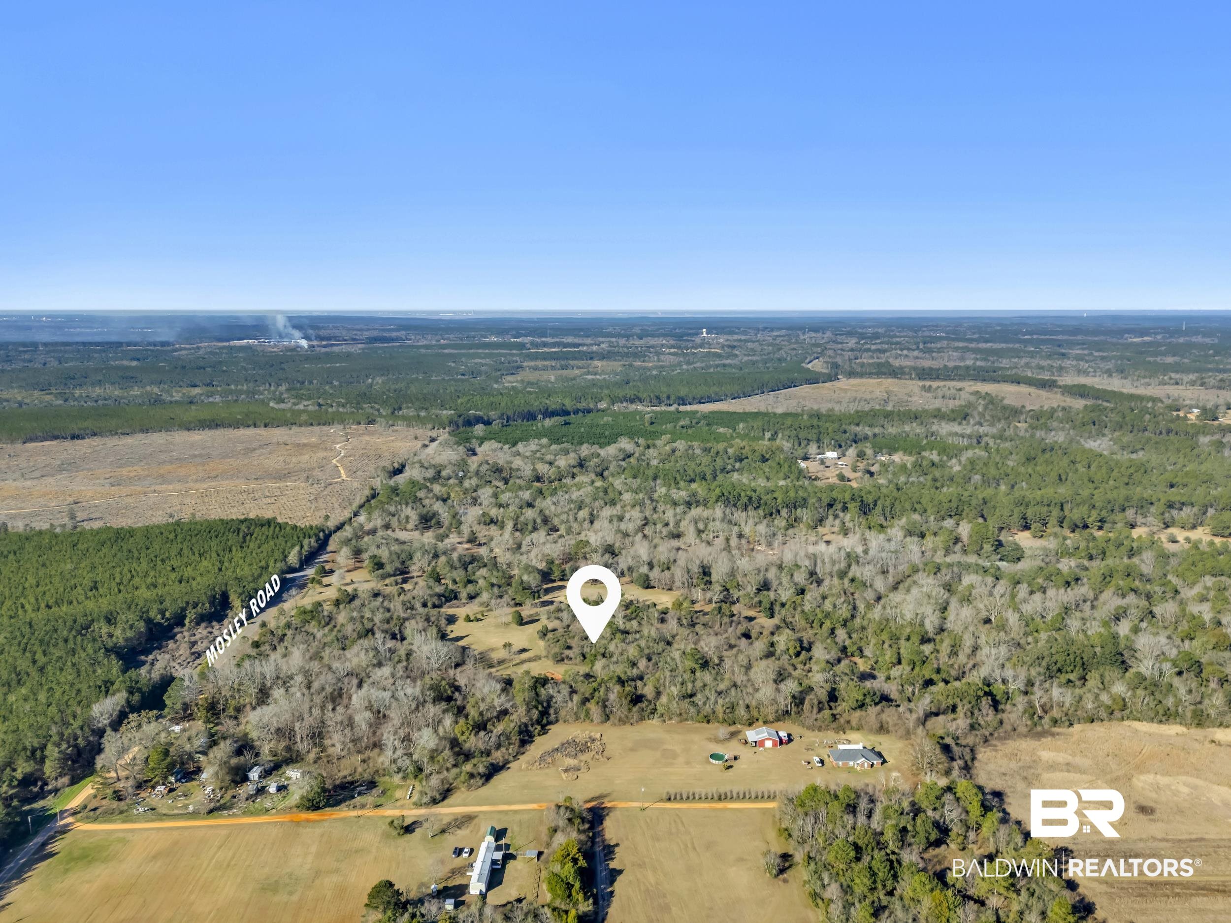 16691 Mosley Road Stapleton, AL 36578 - Photo 20 of 32 Aerial view of sparsely populated area featuring a forest