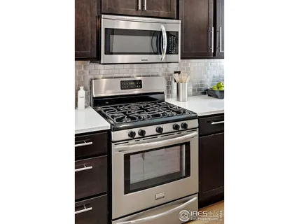 a kitchen with a stove and a microwave