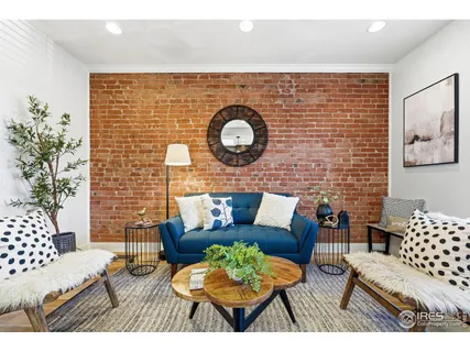 a outdoor living room with furniture and a rug
