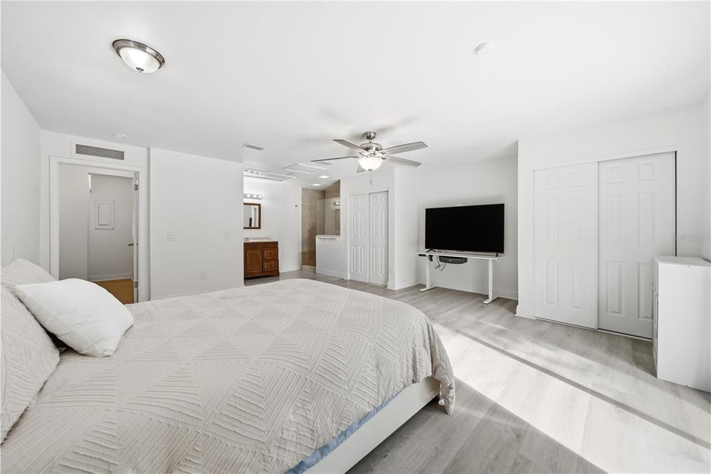 4988 Clarcona Ocoee Road Orlando, FL 32810 - Photo 13 of 48 a bedroom with a bed and a flat screen tv