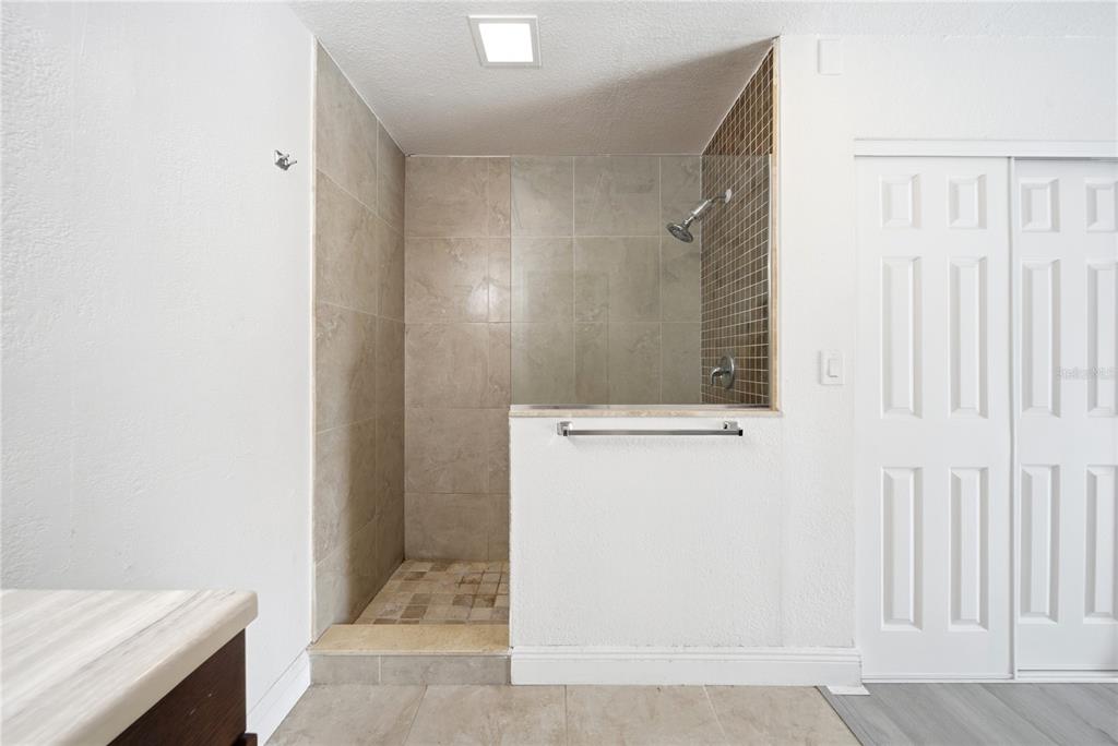 4988 Clarcona Ocoee Road Orlando, FL 32810 - Photo 19 of 48 a bathroom with a sink and a mirror