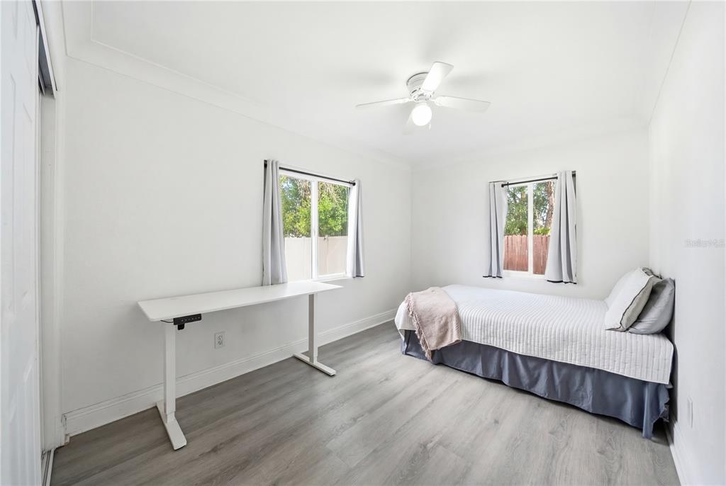 4988 Clarcona Ocoee Road Orlando, FL 32810 - Photo 23 of 48 a bedroom with a bed and a window