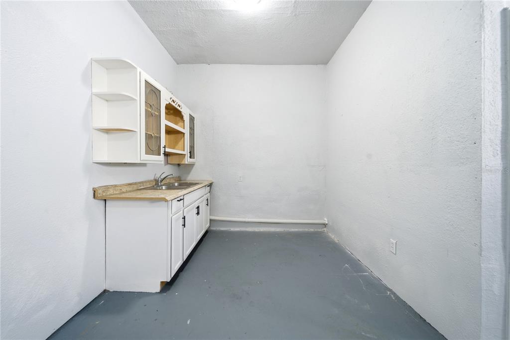 4988 Clarcona Ocoee Road Orlando, FL 32810 - Photo 30 of 48 a bathroom with a granite countertop sink and a mirror