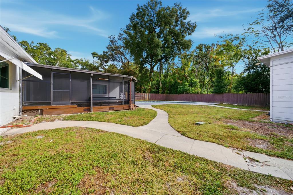 4988 Clarcona Ocoee Road Orlando, FL 32810 - Photo 37 of 48 a view of a backyard with swimming pool