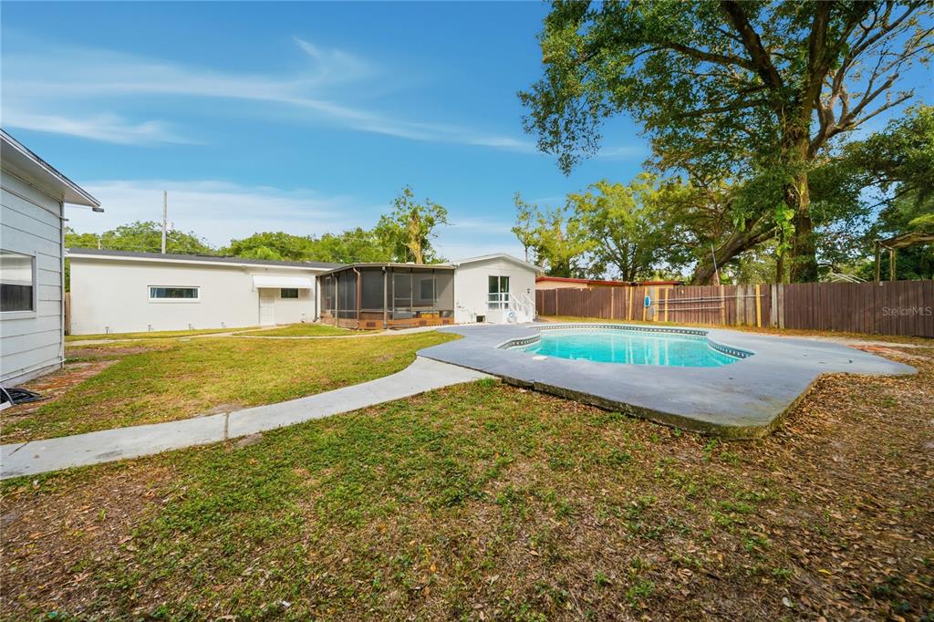 4988 Clarcona Ocoee Road Orlando, FL 32810 - Photo 39 of 48 a view of a house with a yard