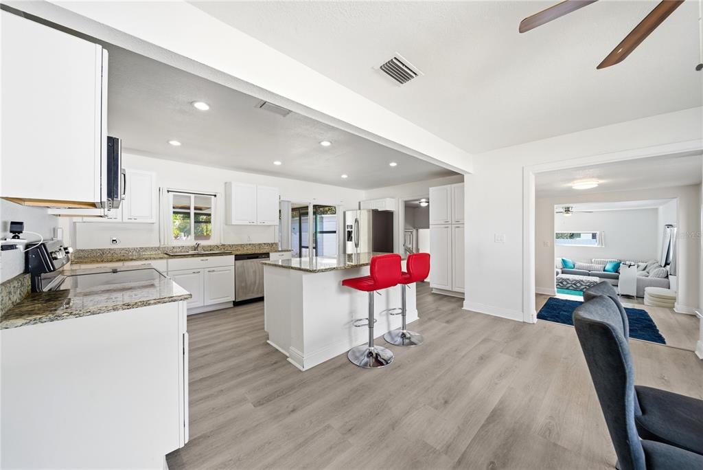 4988 Clarcona Ocoee Road Orlando, FL 32810 - Photo 4 of 48 a living room with furniture and kitchen view