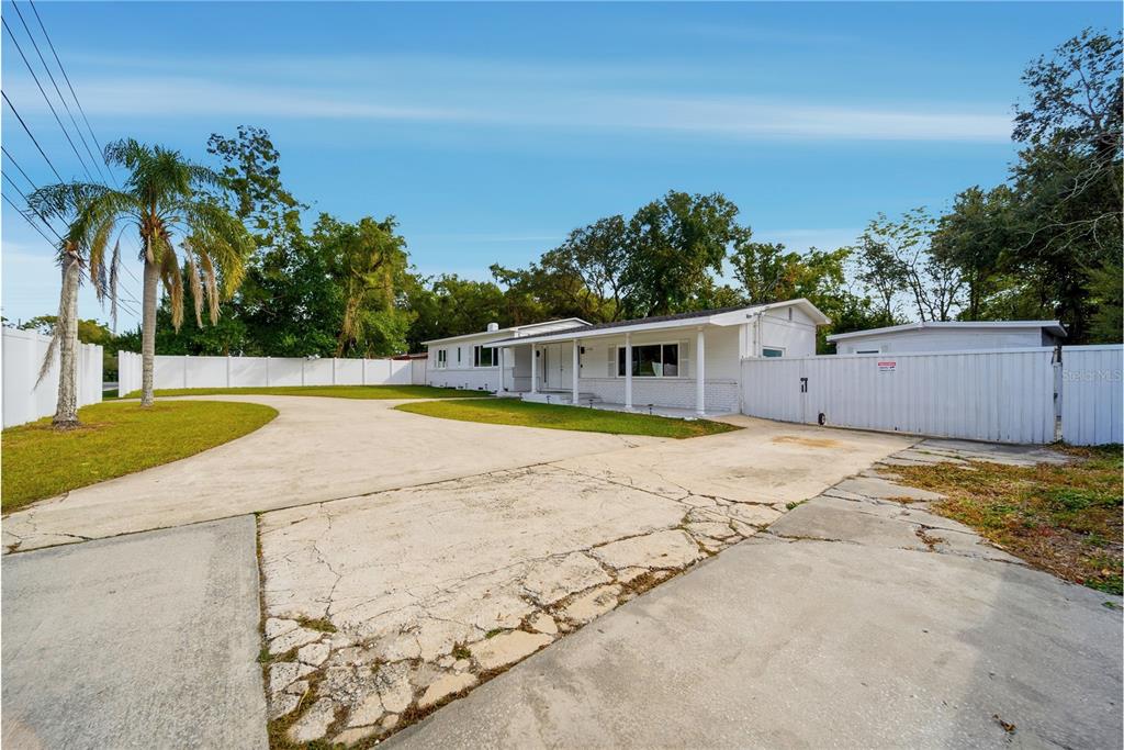 4988 Clarcona Ocoee Road Orlando, FL 32810 - Photo 41 of 48 a view of swimming pool with palm trees