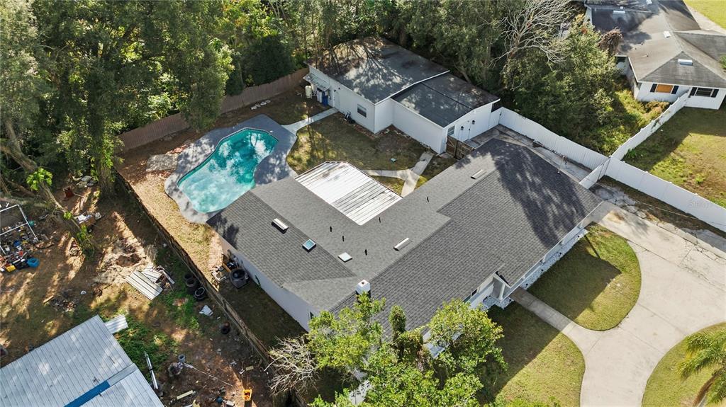 4988 Clarcona Ocoee Road Orlando, FL 32810 - Photo 43 of 48 an aerial view of a house with a yard