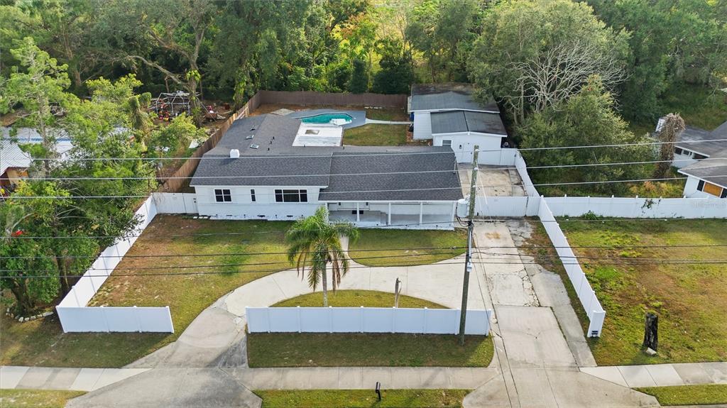 4988 Clarcona Ocoee Road Orlando, FL 32810 - Photo 47 of 48 a view of a swimming pool with a patio