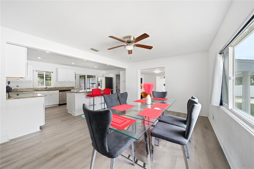 4988 Clarcona Ocoee Road Orlando, FL 32810 - Photo 7 of 48 a dining room with furniture and window