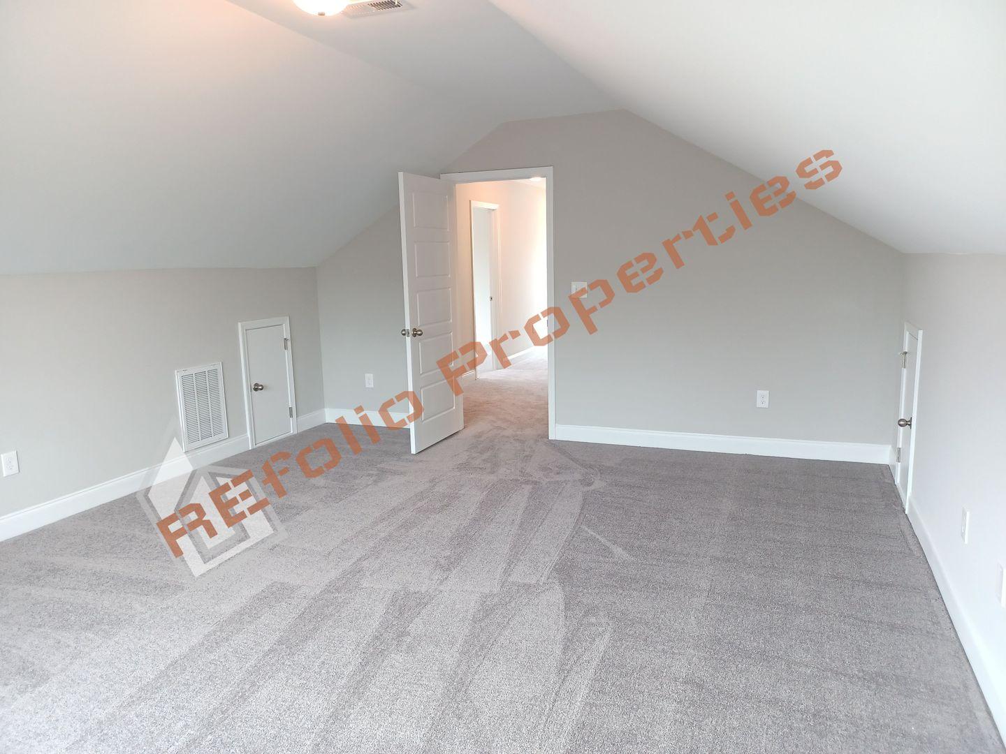 184 Howards Crossing Drive Wendell, NC 27591 - Photo 22 of 29 a view of a livingroom with an empty space