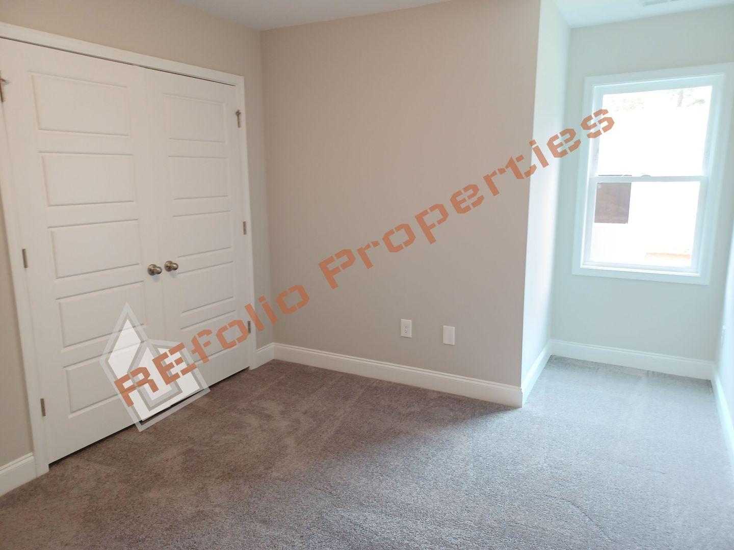 184 Howards Crossing Drive Wendell, NC 27591 - Photo 23 of 29 an empty room with windows