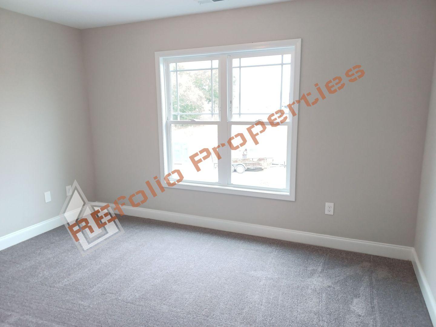 184 Howards Crossing Drive Wendell, NC 27591 - Photo 26 of 29 an empty room with a window