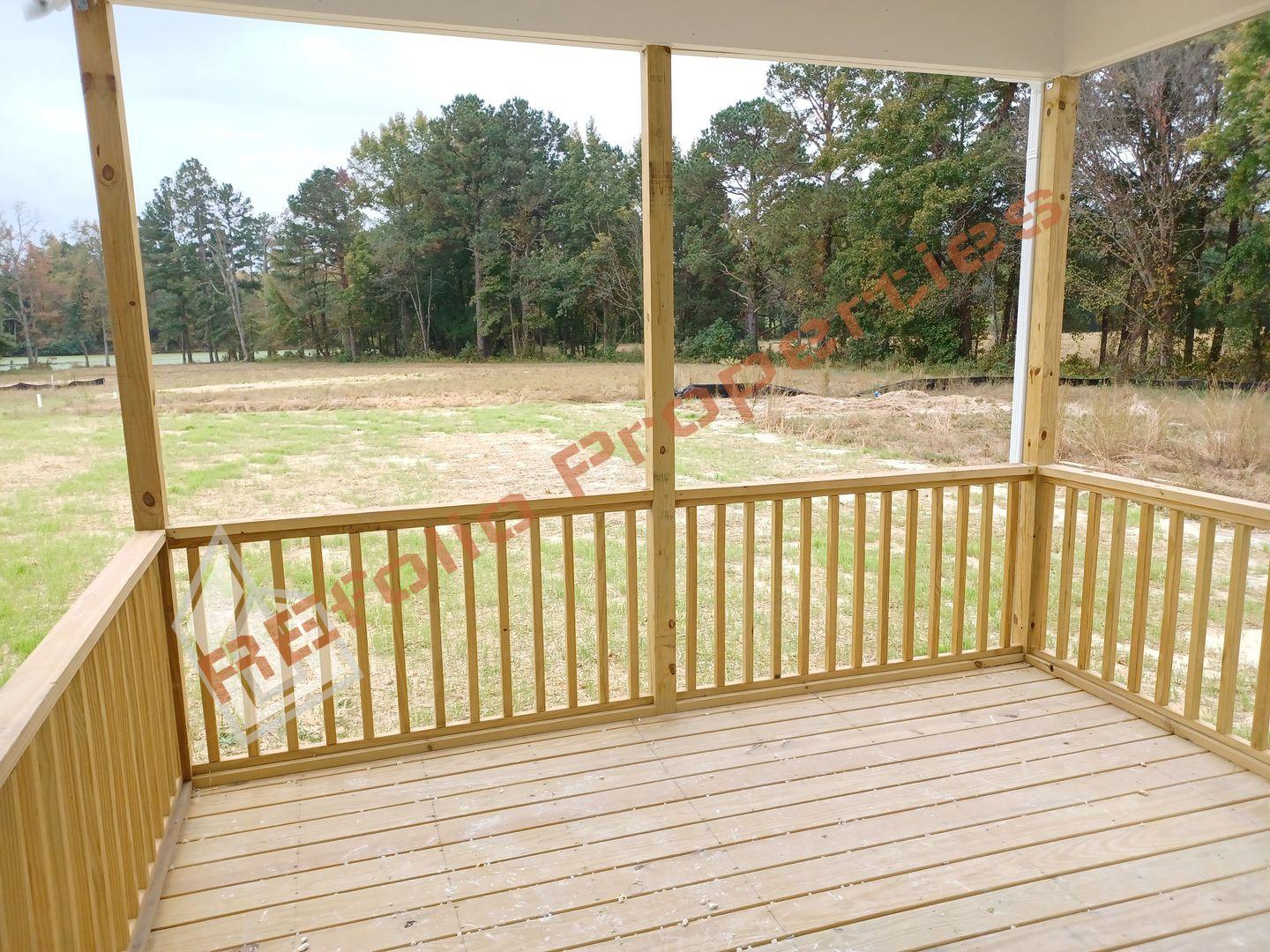 184 Howards Crossing Drive Wendell, NC 27591 - Photo 28 of 29 a view of a wooden deck