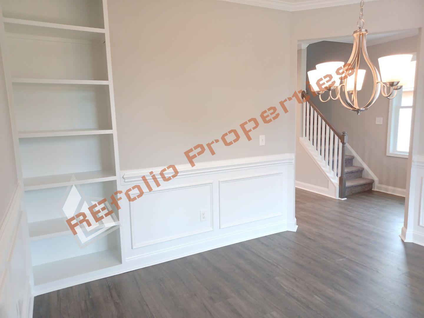 184 Howards Crossing Drive Wendell, NC 27591 - Photo 4 of 29 a view of an entryway with wooden floor