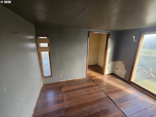 a view of an empty room and window