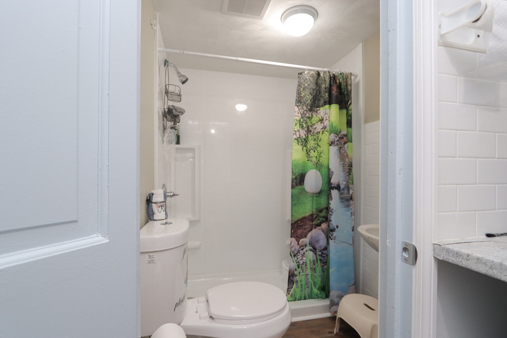 34 Preston Street Springfield, MA 01109 - Photo 26 of 34 a bathroom with a toilet and a shower