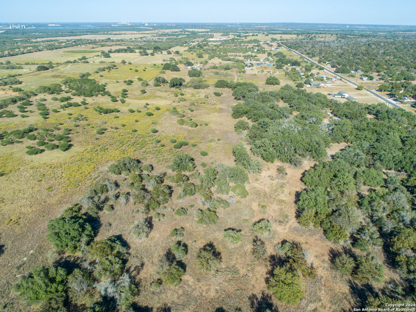 21123 Lamm Road Elmendorf, TX 78112 - Photo 8 of 45 a view of a yard with an outdoor space