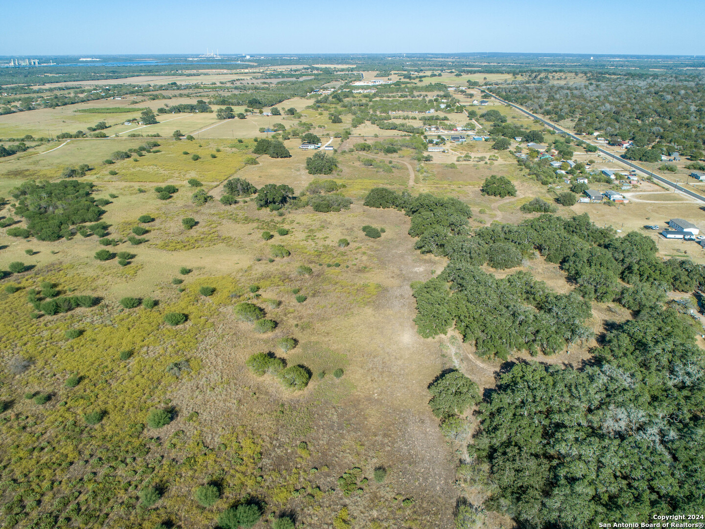 21123 Lamm Road Elmendorf, TX 78112 - Photo 9 of 45 a view of a lake view with beach