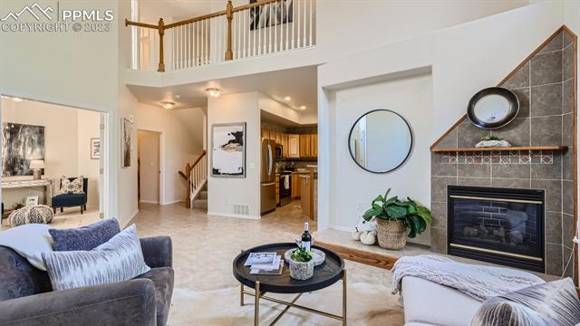 5647 Sonnet Ridge Point Colorado Springs, CO 80918 - Photo 6 of 28 Living Room View to Office, Kitchen and Stairway