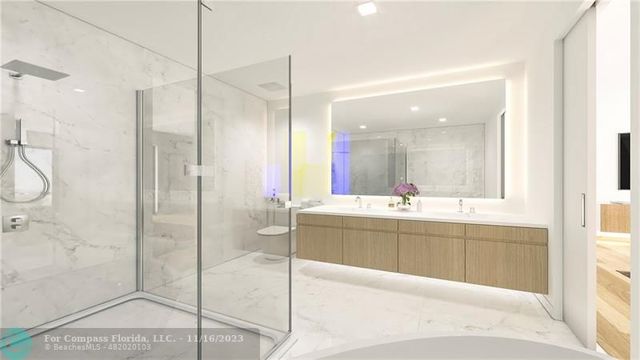 a bathroom with a tub a sink shower and mirror