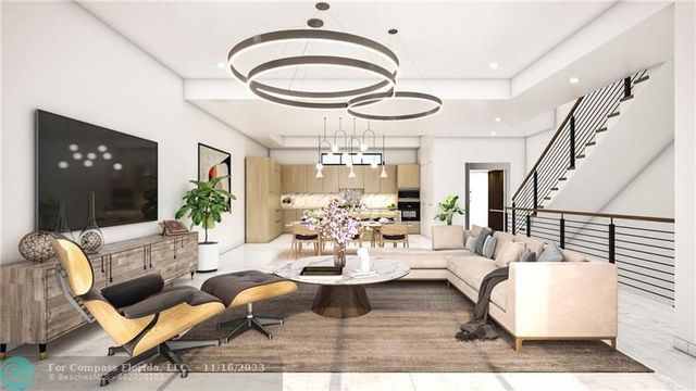 a living room with furniture and chandelier