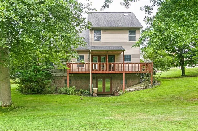 a view of a house with a backyard