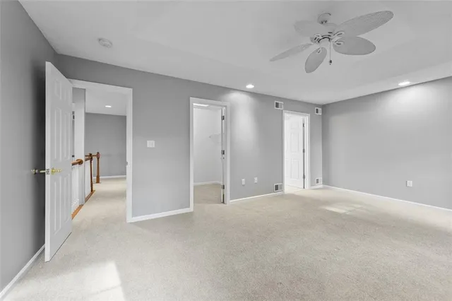 a spacious bathroom with a double vanity sink and a mirror