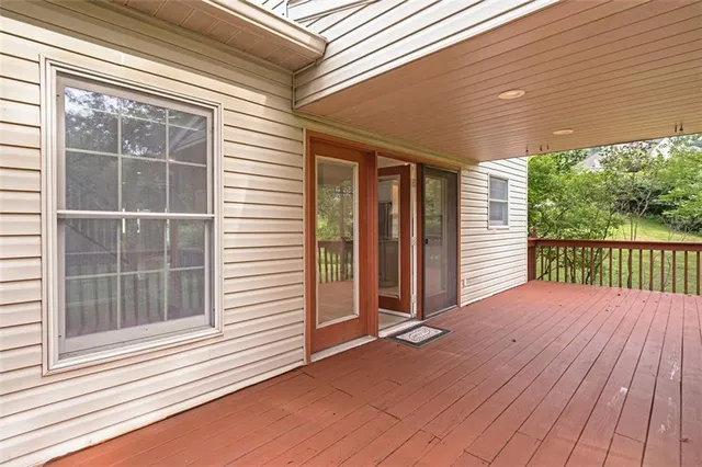 a view of balcony with wooden floor
