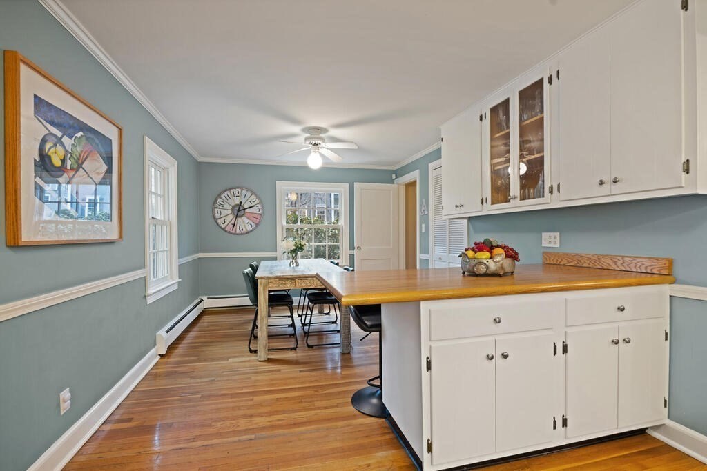 26 Virginia Road Needham, MA 02494 - Photo 12 of 41 a view of a kitchen with cabinets and wooden floor