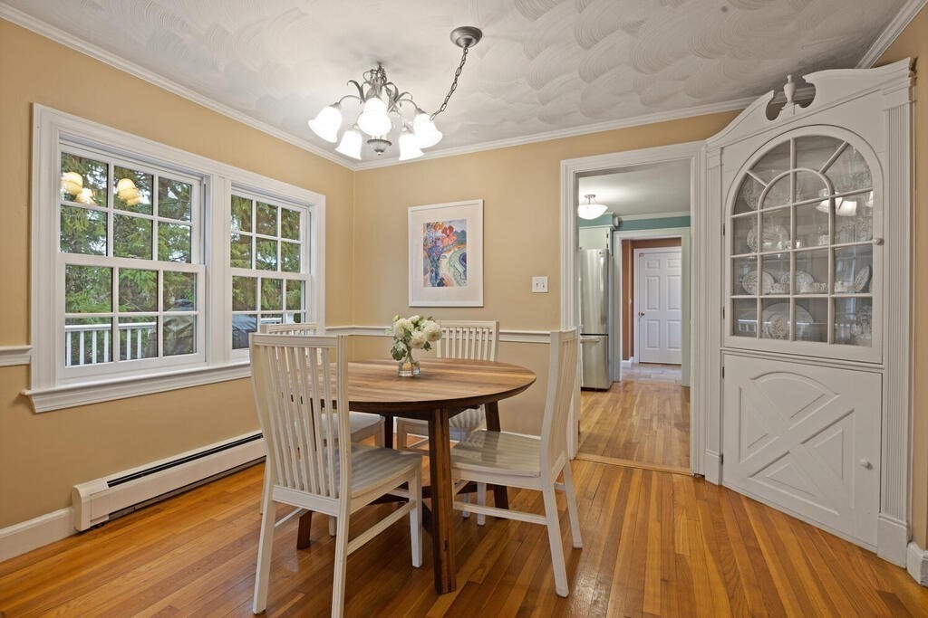 26 Virginia Road Needham, MA 02494 - Photo 15 of 41 a view of a dining room with furniture and wooden floor