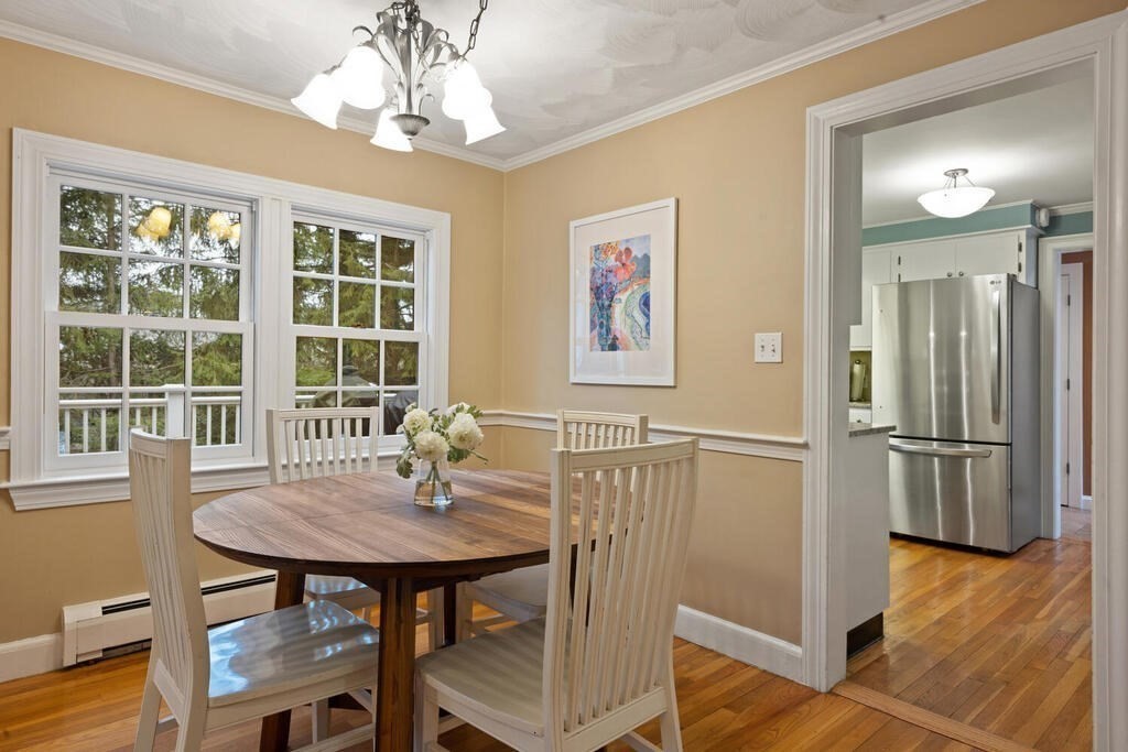26 Virginia Road Needham, MA 02494 - Photo 16 of 41 a view of a dining room with furniture window and wooden floor