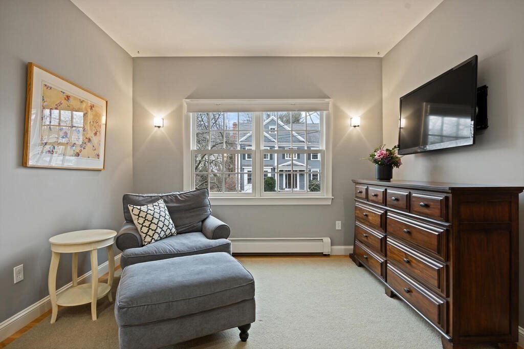 26 Virginia Road Needham, MA 02494 - Photo 20 of 41 a bedroom with furniture and a flat screen tv