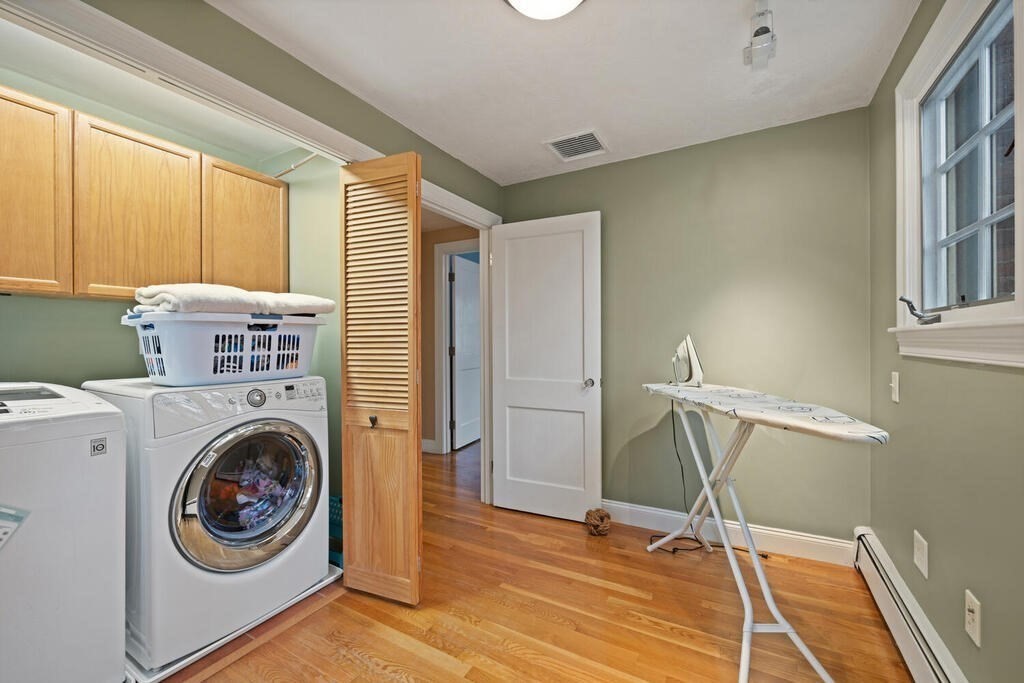 26 Virginia Road Needham, MA 02494 - Photo 28 of 41 a view of a storage & utility room with washer and dryer