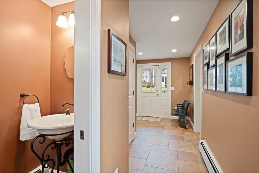26 Virginia Road Needham, MA 02494 - Photo 36 of 41 a bathroom with a sink and a mirror