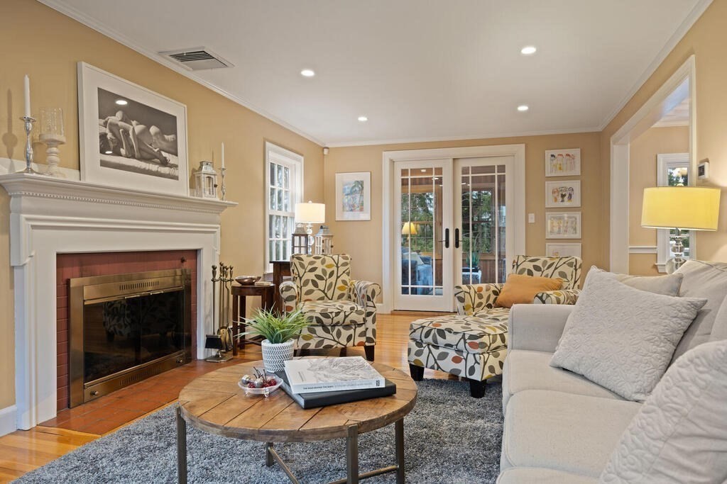 26 Virginia Road Needham, MA 02494 - Photo 5 of 41 a living room with furniture and a fireplace