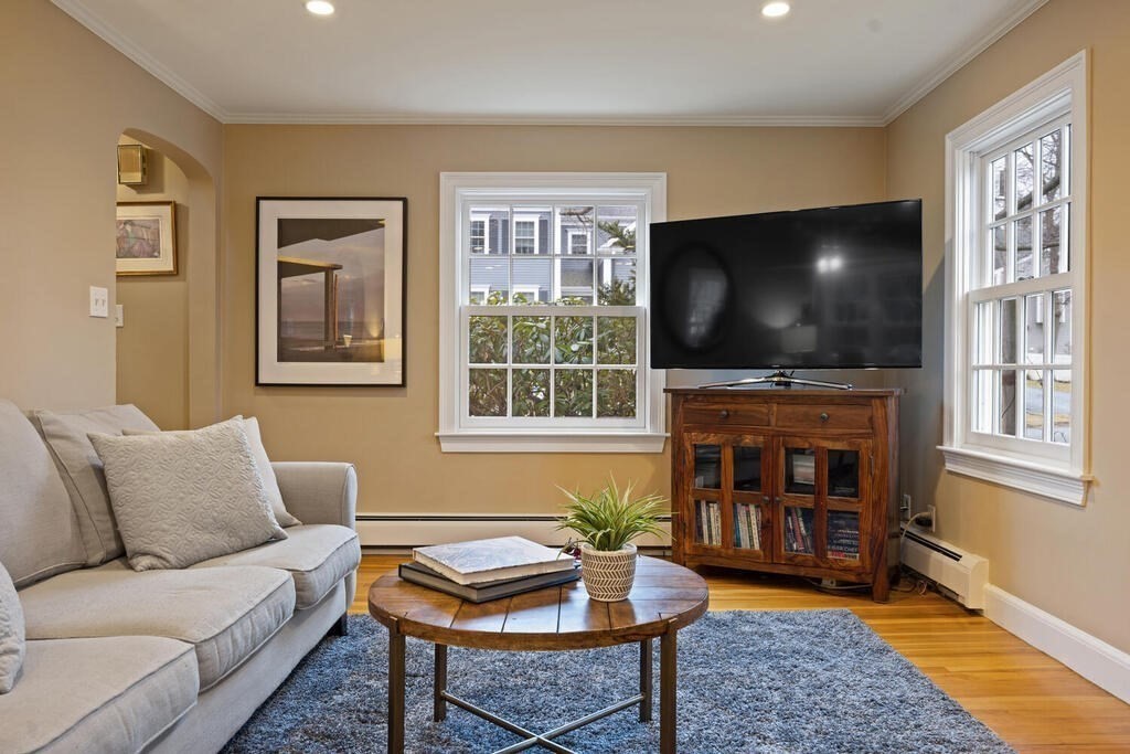 26 Virginia Road Needham, MA 02494 - Photo 6 of 41 a living room with fireplace furniture and a flat screen tv
