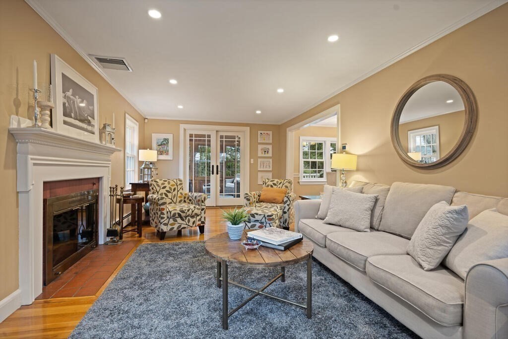 26 Virginia Road Needham, MA 02494 - Photo 7 of 41 a living room with furniture and a fireplace
