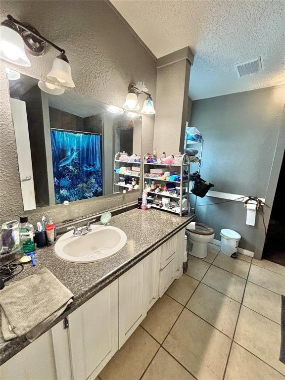 119 Overlook Trail Azle, TX 76020 - Photo 16 of 20 a bathroom with a sink double vanity and a mirror