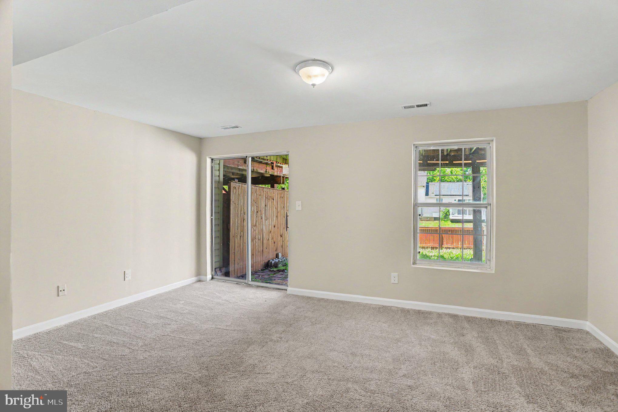 32 Tameron Place Rosedale, MD 21237 - Photo 25 of 39 Sliding door access to backyard from basement