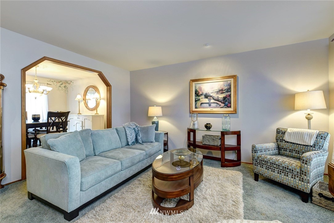 23814 23rd Drive Southeast Bothell, WA 98021 - Photo 2 of 26 a living room with furniture and a large window