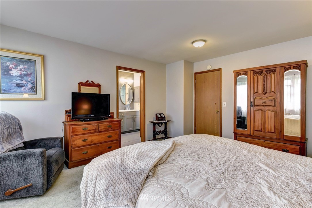 23814 23rd Drive Southeast Bothell, WA 98021 - Photo 14 of 26 a bedroom with a bed and a television