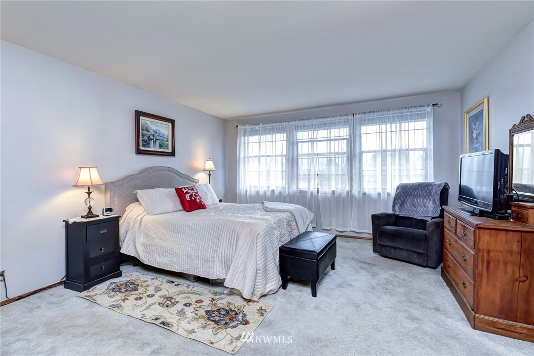 23814 23rd Drive Southeast Bothell, WA 98021 - Photo 15 of 26 a bedroom with a bed and a couch