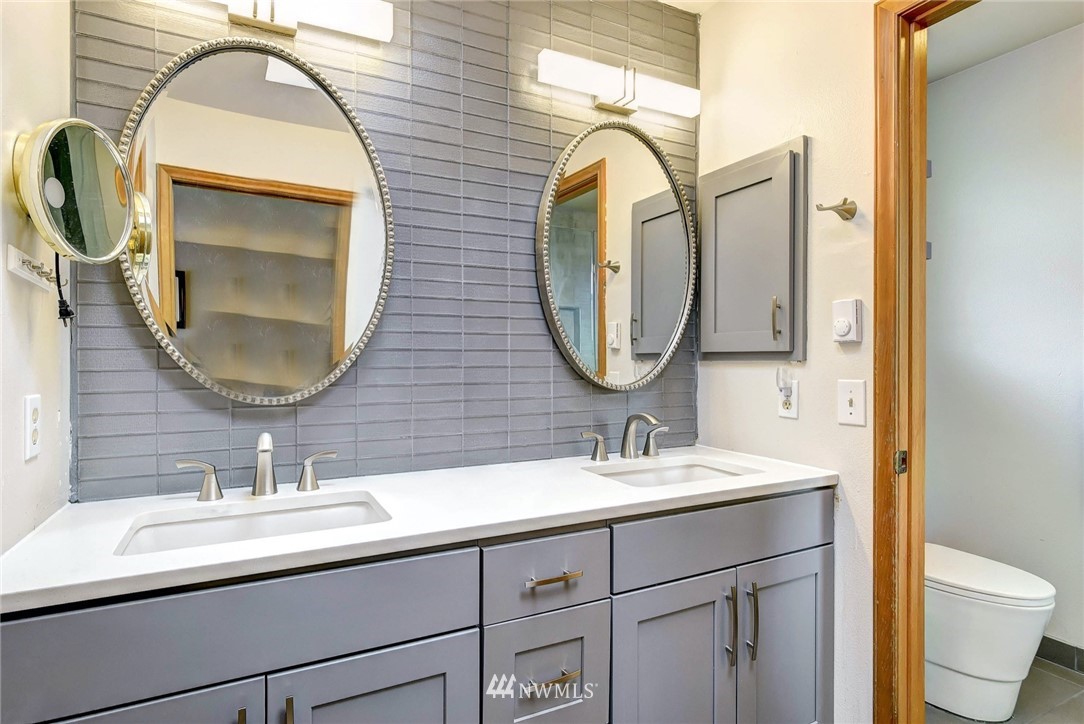 23814 23rd Drive Southeast Bothell, WA 98021 - Photo 16 of 26 a bathroom with a sink and a mirror