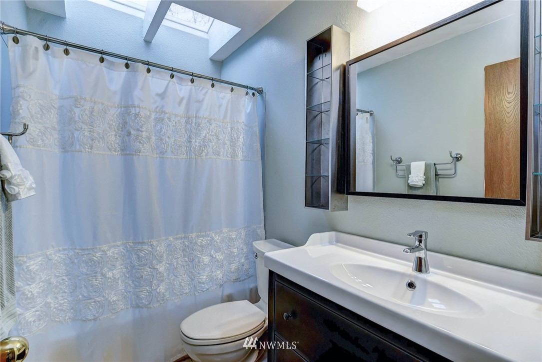 23814 23rd Drive Southeast Bothell, WA 98021 - Photo 20 of 26 a bathroom with a sink a toilet and shower