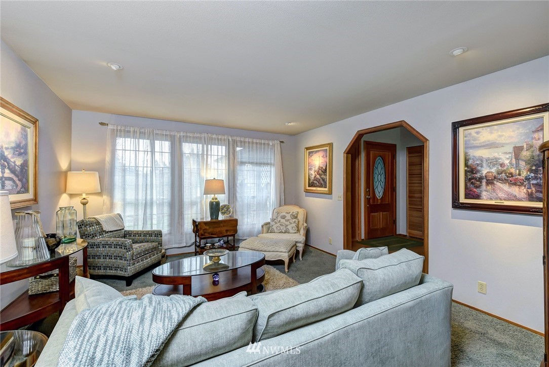 23814 23rd Drive Southeast Bothell, WA 98021 - Photo 3 of 26 a living room with furniture and large windows