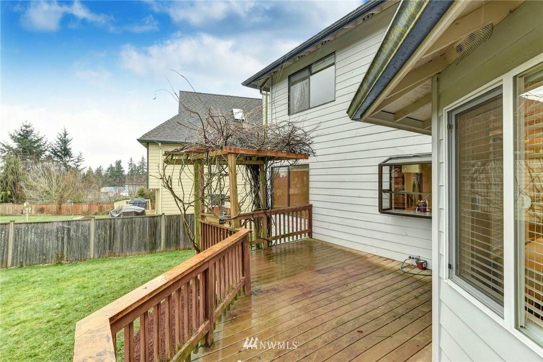 23814 23rd Drive Southeast Bothell, WA 98021 - Photo 22 of 26 a view of a wooden deck and a yard