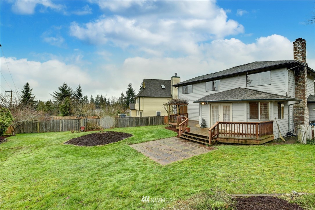 23814 23rd Drive Southeast Bothell, WA 98021 - Photo 24 of 26 a front view of a house with a garden