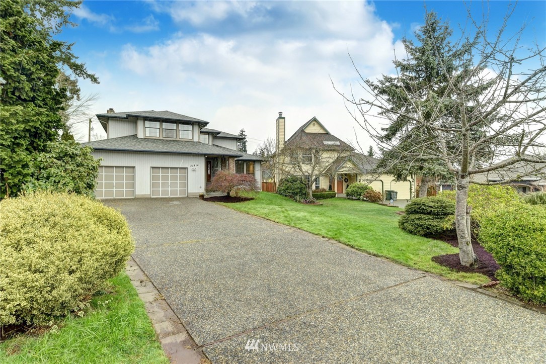 23814 23rd Drive Southeast Bothell, WA 98021 - Photo 26 of 26 a front view of a house with a garden
